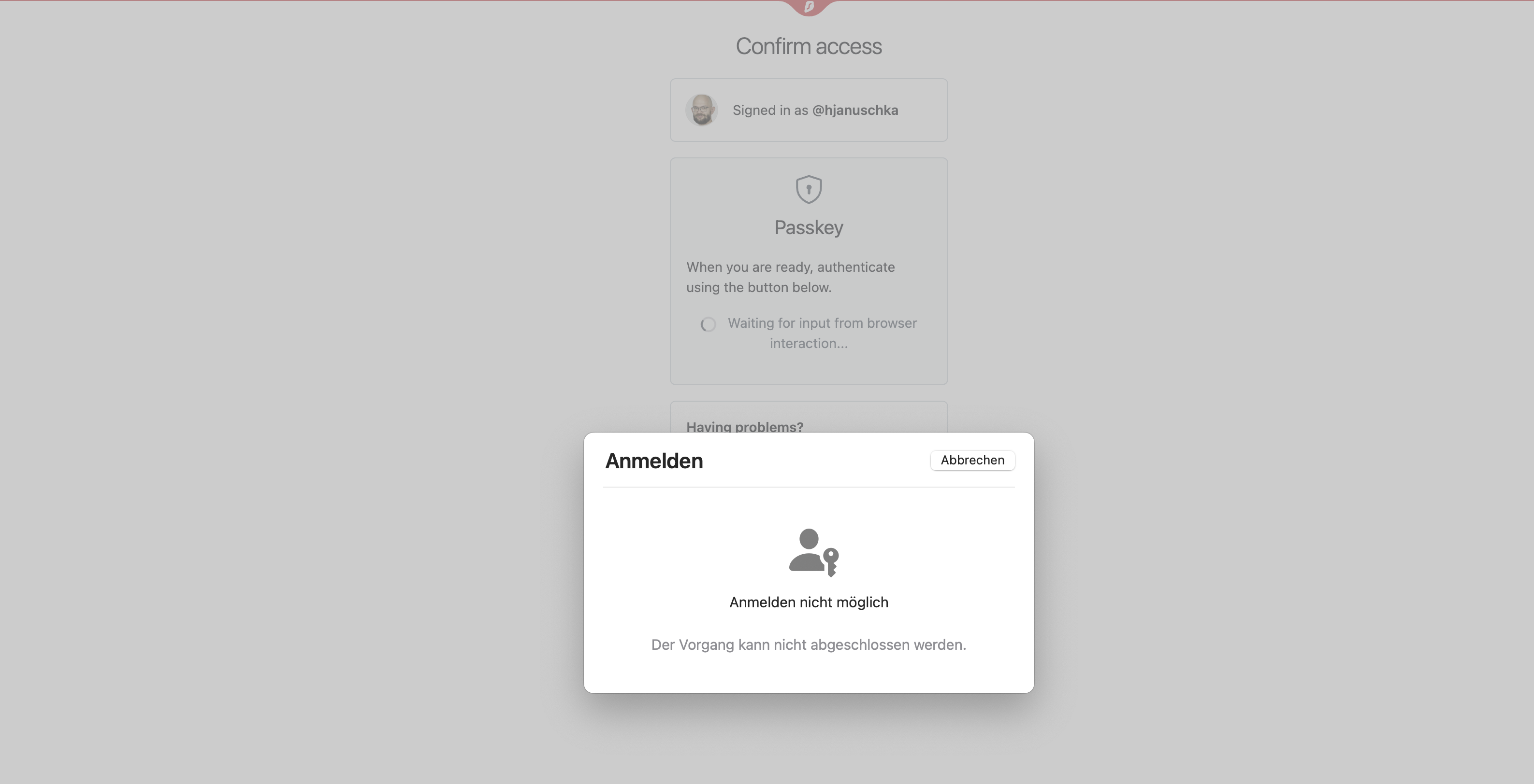 Stuck macOS passkey sheet over a dimmed browser window